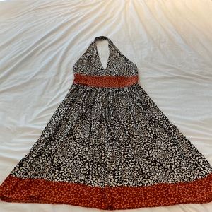 Halter fit and flare above knee dress perfect for tropical wedding or event